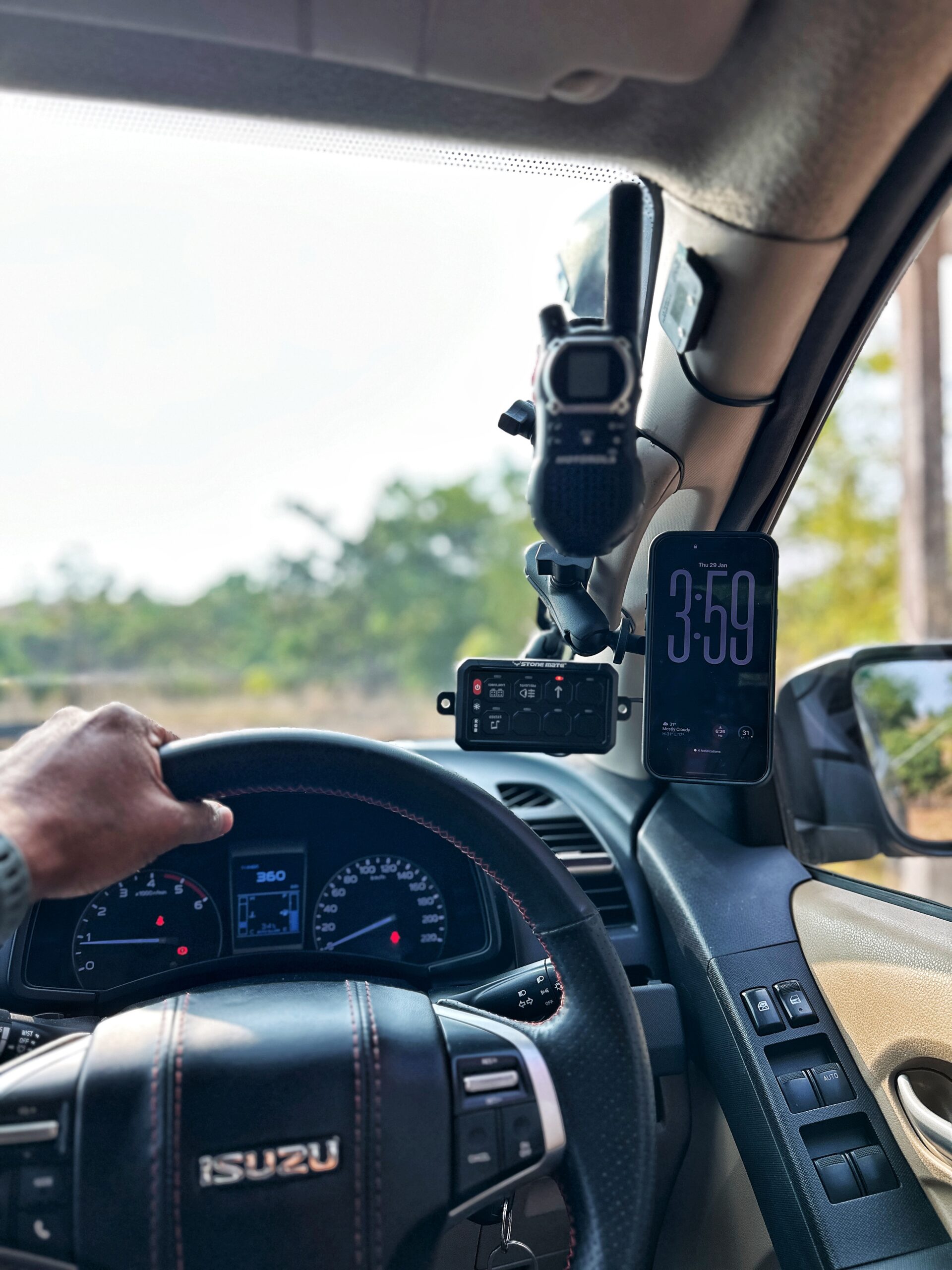 RevCraft A-Pillar Mount bracket with triple 1-inch ball base installed inside 4x4 cabin, Modular A-pillar mounting bracket with 3 one-inch ball mounts, 4x4 A-pillar accessory mount with universal 1-inch ball system, RevCraft A-Pillar Mount installed on vehicle A-pillar with modular ball mounts, Cabin A-pillar bracket holding 1-inch ball mounting system, Interior A-pillar mount setup for phone walkie and camera modules, Close-up of RevCraft A-Pillar bracket with three 1-inch ball mounts, Textured metal A-pillar mounting bracket with ball system, Modular A-pillar mount base with universal ball joints, A-pillar mount holding action camera inside off-road vehicle, Modular cabin mount supporting phone and camera on A-pillar, 4x4 interior A-pillar mounting system in use