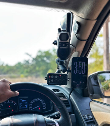 RevCraft A-Pillar Mount bracket with triple 1-inch ball base installed inside 4x4 cabin, Modular A-pillar mounting bracket with 3 one-inch ball mounts, 4x4 A-pillar accessory mount with universal 1-inch ball system, RevCraft A-Pillar Mount installed on vehicle A-pillar with modular ball mounts, Cabin A-pillar bracket holding 1-inch ball mounting system, Interior A-pillar mount setup for phone walkie and camera modules, Close-up of RevCraft A-Pillar bracket with three 1-inch ball mounts, Textured metal A-pillar mounting bracket with ball system, Modular A-pillar mount base with universal ball joints, A-pillar mount holding action camera inside off-road vehicle, Modular cabin mount supporting phone and camera on A-pillar, 4x4 interior A-pillar mounting system in use