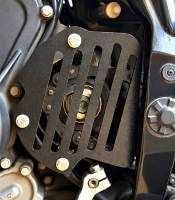 RevCraft KTM 390 Adventure heel guard set featuring precision laser-cut black metal construction with lightweight slotted design and OEM-style fitment